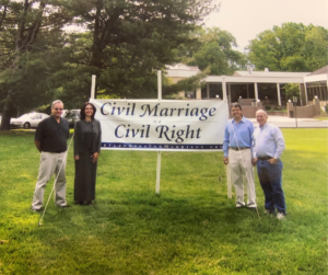 Civil Marriage Sign outside TE in 2007 with clergy, staff, and volunteer