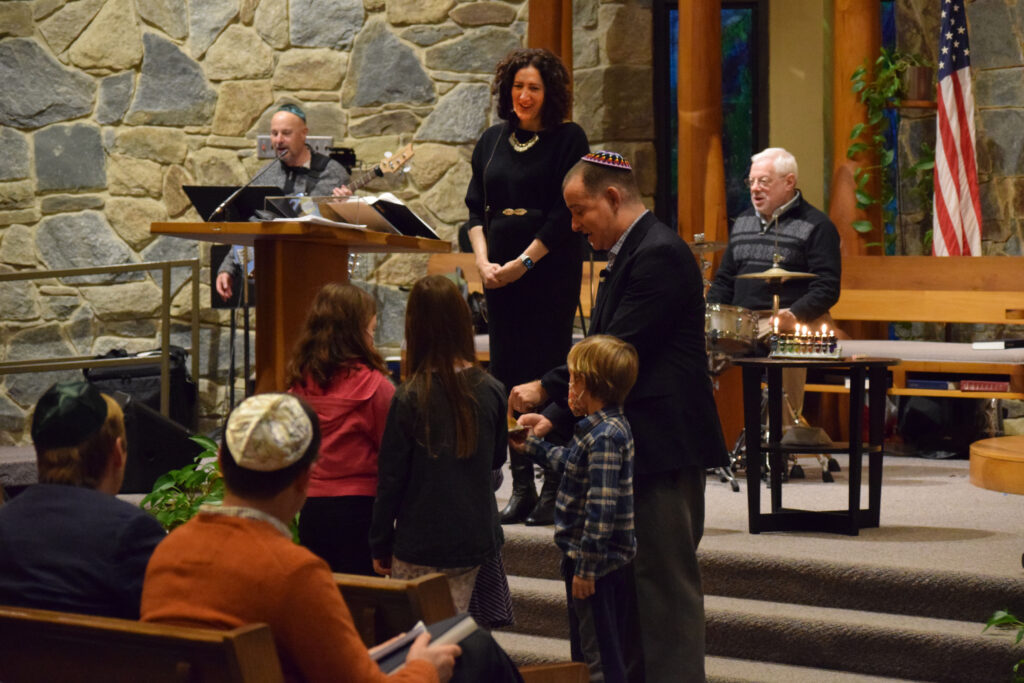 Rabbi Adam and Cantor Lindsay leading services